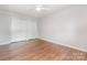 Bedroom with hardwood floors, ceiling fan, baseboard trim and double closets at 3201 Heathstead Pl # C, Charlotte, NC 28210