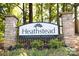 Heathstead condominium community entrance sign framed by stone pillars and green landscaping at 3201 Heathstead Pl # C, Charlotte, NC 28210
