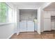 A conveniently located laundry room is equipped with washer, dryer, and water heater offering easy access to laundry facilities at 3201 Heathstead Pl # C, Charlotte, NC 28210