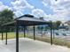 Stylish poolside gazebo offers shade and relaxation overlooking the pool area at 3201 Heathstead Pl # C, Charlotte, NC 28210