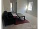 Cozy living room is carpeted and has natural light from large windows at 345 Hyssop Ct, Fort Mill, SC 29715