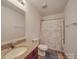 Cozy bathroom featuring vanity with solid surface countertop, toilet and tub shower at 417 Homestead Ln, Albemarle, NC 28001