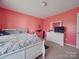 Bedroom featuring light colored walls, carpeted floor, and a large window providing plenty of natural light at 417 Homestead Ln, Albemarle, NC 28001