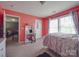 Bedroom featuring light colored walls, carpeted floor, and a large window providing plenty of natural light at 417 Homestead Ln, Albemarle, NC 28001