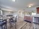 The dining area showcases a breakfast nook and table, with an open-concept view of the kitchen at 417 Homestead Ln, Albemarle, NC 28001