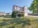 Inviting two-story home with a lush green lawn and attached garage, set under a clear blue sky at 417 Homestead Ln, Albemarle, NC 28001