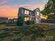 Charming two-story home with a well-manicured lawn and inviting front porch, perfect for relaxing evenings at 417 Homestead Ln, Albemarle, NC 28001
