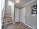 Hallway features a carpeted staircase with white railing and neutral gray walls at 417 Homestead Ln, Albemarle, NC 28001