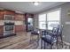 Cozy eat-in kitchen featuring stainless steel appliances, granite countertops, and a breakfast nook at 417 Homestead Ln, Albemarle, NC 28001