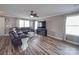Bright and airy living room with hardwood floors, a plush leather sofa, and plenty of natural light at 417 Homestead Ln, Albemarle, NC 28001