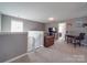 Bright and airy living space features a sectional sofa, desk, and staircase access at 417 Homestead Ln, Albemarle, NC 28001
