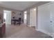 Open concept living area provides ample space with a desk and access to other rooms at 417 Homestead Ln, Albemarle, NC 28001