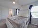 Bright main bedroom with white furniture, plush bedding, and ensuite bathroom access at 417 Homestead Ln, Albemarle, NC 28001