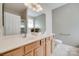 Bright bathroom with double vanity, cream counters, framed mirrors, and a tiled floor at 422 Garnet Ct, Fort Mill, SC 29708