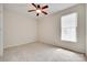 Cozy bedroom filled with natural light through a large window and a ceiling fan at 422 Garnet Ct, Fort Mill, SC 29708