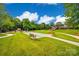 Well-manicured community lawn with benches, walkway, and seating area for residents at 422 Garnet Ct, Fort Mill, SC 29708