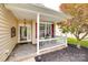 Inviting covered front porch with stone flooring, ideal for relaxing and enjoying the outdoors with potted plants at 422 Garnet Ct, Fort Mill, SC 29708