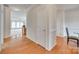 Open hallway with hardwood floors leading to the living room, offering a seamless flow throughout the home at 422 Garnet Ct, Fort Mill, SC 29708