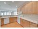 Bright kitchen with white countertops, wood cabinets, and open view to living space, perfect for gatherings at 422 Garnet Ct, Fort Mill, SC 29708