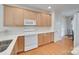 Well-lit kitchen with white countertops, wood cabinets, and modern appliances, offering a functional and stylish space at 422 Garnet Ct, Fort Mill, SC 29708