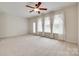 Inviting living room boasting natural light from large windows and a ceiling fan for comfort at 422 Garnet Ct, Fort Mill, SC 29708