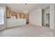 Bright open living room with hardwood floors in the kitchen, chandelier, and neutral decor at 422 Garnet Ct, Fort Mill, SC 29708