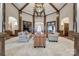 Spacious lobby featuring wood columns, arched doorways, a large chandelier, seating and neutral-toned tile floors at 422 Garnet Ct, Fort Mill, SC 29708