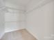 Walk-in closet with white wire shelving and neutral carpet at 422 Garnet Ct, Fort Mill, SC 29708