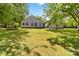 Expansive backyard with a well-manicured lawn, mature trees, and plenty of space for outdoor activities at 4960 York Hwy, Rock Hill, SC 29732