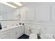 Well-lit bathroom with a double sink vanity and ample storage space in the white cabinets and classic white fixtures at 4960 York Hwy, Rock Hill, SC 29732