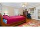 Comfortable bedroom with hardwood floors, a ceiling fan, and warm natural light at 4960 York Hwy, Rock Hill, SC 29732