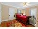 Cozy bedroom featuring a ceiling fan, hardwood floors, and access to an ensuite bathroom at 4960 York Hwy, Rock Hill, SC 29732