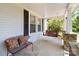 Cozy porch area with stone pillars, a bench, and porch swing for relaxing at 4960 York Hwy, Rock Hill, SC 29732