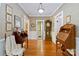Charming hallway with decorative wallpaper, hardwood floors, and antique furniture accents at 4960 York Hwy, Rock Hill, SC 29732