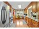 Functional kitchen with stainless steel appliances, wooden cabinets, and a cozy breakfast nook at 4960 York Hwy, Rock Hill, SC 29732