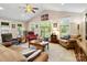 Spacious living room featuring a vaulted ceiling, large windows, and comfortable seating area at 4960 York Hwy, Rock Hill, SC 29732