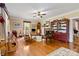 Cozy living room featuring hardwood floors, a fireplace, and a ceiling fan at 4960 York Hwy, Rock Hill, SC 29732