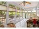 Bright sunroom with tile floors, large windows, and access to a deck overlooking the backyard at 4960 York Hwy, Rock Hill, SC 29732
