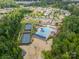 View of community clubhouse, tennis courts, pool, parking and green spaces between residential properties at 509 Silers Bald Dr, Fort Mill, SC 29715