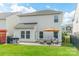 Spacious backyard with a patio featuring comfortable outdoor seating and a grill at 509 Silers Bald Dr, Fort Mill, SC 29715