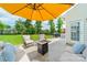 Cozy backyard patio features a fire pit, comfortable seating, and a grill, perfect for outdoor entertaining at 509 Silers Bald Dr, Fort Mill, SC 29715