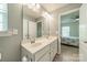 Bright bathroom with a double sink vanity and view into the bedroom at 509 Silers Bald Dr, Fort Mill, SC 29715