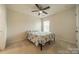 Cozy bedroom with carpet, ceiling fan, and natural light from a window at 509 Silers Bald Dr, Fort Mill, SC 29715