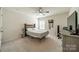 Comfortable bedroom with a ceiling fan, desk, and ample natural light at 509 Silers Bald Dr, Fort Mill, SC 29715