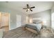 Cozy bedroom with wood floors, neutral paint, and a ceiling fan at 509 Silers Bald Dr, Fort Mill, SC 29715