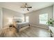 Relaxing bedroom with natural light, wood floors, and neutral paint at 509 Silers Bald Dr, Fort Mill, SC 29715