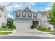 Attractive two-story home with a well-maintained lawn, two-car garage, and inviting curb appeal at 509 Silers Bald Dr, Fort Mill, SC 29715