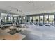A gym features treadmills, weight machines, free weights, ceiling fans, and plenty of natural light at 509 Silers Bald Dr, Fort Mill, SC 29715