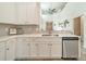 This kitchen features bright white cabinets, stainless steel appliances, and an eat-in counter at 509 Silers Bald Dr, Fort Mill, SC 29715