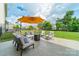 Inviting patio with comfortable seating, an umbrella, and a cozy fire pit at 509 Silers Bald Dr, Fort Mill, SC 29715